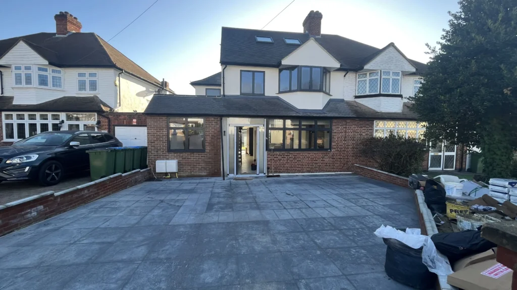 Comprehensive home transformation including double-storey extension, garage conversion, hip-to-gable loft conversion and garden building in Eltham, London